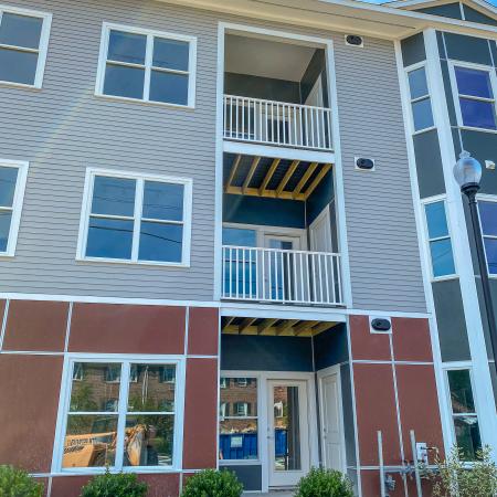 Exterior of apartments showing balconies in annex apartment at Dover Apartments in Dover, NH.