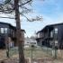 exterior building and dog park at riverview trail apartments in whitefish mt