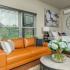 Orange couch in studio apartment in Galloway