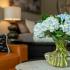 Blue flowers on coffee table in studio apartment