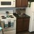 Newly remodeled kitchen with white appliances and cherry oak cabinets