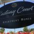 Eastway court sign with pink and red flowers