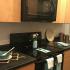 Newly remodeled kitchen with black appliances and light brown cabinets