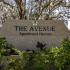 The Avenue Apartments, exterior, stone property sign, trees, plants