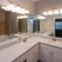 Bathroom: large mirror, vanity, sink toilet and bathtub