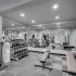 Fitness Center with white walls, weights, and mirrors