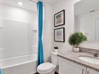 Elegant bathroom with white finishes at a home for rent in Apopka, Florida.