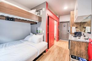 lofted beds in a modern-style micro apartment