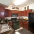 full equipped kitchen with black appliances