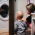 Baby and mom doing laundry