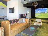 Comfortable Seating and Extra Large Flat-Screen TV in Spacious Community Club House | Rise on Apache | Tempe, AZ Student Living