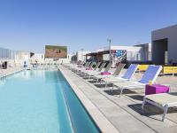 Pool and Sun Deck with Loungers | Rise on Apache | Apartments In Tempe, AZ