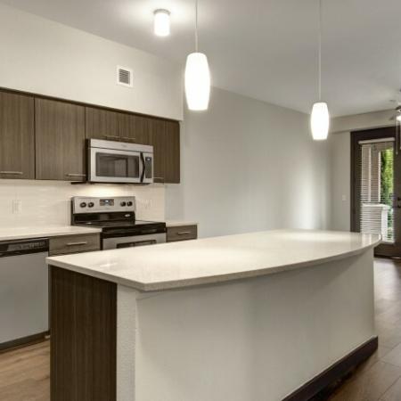 Residents Snacking in the Kitchen | Apartments For Rent Hillsboro Oregon | Tessera at Orenco Station 2