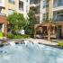 Sparkling Pool and in-pool lounge area | Domain West | Apartments in Houston, TX