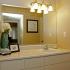 Large bathroom vanity with large mirror and plenty of county space