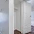 View of large hallway linen closet and upgraded bathroom