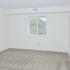 Bedroom with beige carpet and a window at Gladstone Towers apartments for rent in Lansdowne, PA
