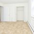 Apartment bedroom with beige carpeting and large closet
