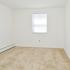 Bedroom with white walls, window, and carpeting in apartment for rent in Phoenixville, PA
