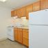 Kitchen with beige tile flooring at Boothwyn Court apartments for rent in Boothwyn, PA