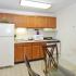 Kitchen with brown cabinets at Country Manor apartments for rent in Levittown, PA