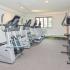 Fitness center with treadmills, ellipticals, stationary bikes and weights at Whiteland West Apartments in Exton, PA.
