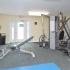 Fitness center with cable machine and bench at Fairway Park apartments for rent in Wilmington, DE