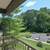 Shaded balcony overlooks the parking lot at Summit Trace Apartments in Langhorne, PA.