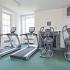 Cardio machines next to large window in apartment fitness center in King of Prussia, PA