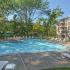Pool with lounge chairs at King of Prussia apartment complex