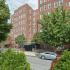 Residential building with green bushes at Gilpin Place apartments for rent in Wilmington, DE