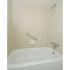 Bathroom with a bathtub and beige shower tile at Fox Run apartments for rent