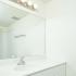 Bathroom with white vanity and mirror at Cedar Tree Village apartments for rent in Wilmington, DE