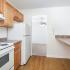 Kitchen with dining room view and countertops at Cedar Tree Village apartments for rent