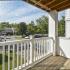 Private balcony with railing and view of the Glen Eagle Village Apartments community