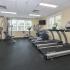 Community fitness center with treadmills, elliptical and weight machines at Norwood House Apartments in Downingtown, PA.