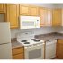 Model kitchen with modern appliances at Oak Tree Apartments in Newark, DE.