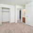 Carpeted bedroom with a closet at Victoria Crossing Apartments in Reading, PA.