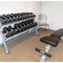 Fitness center with weights and bench at City View apartments for rent in Lancaster, PA