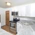Kitchen with grey countertops and contemporary backsplash in apartment for rent in Phoenixville, PA