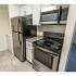 Kitchen with stainless steel appliances at Fox Run apartments for rent in Warminster, PA