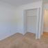 Carpeted bedroom with closet at Rosetree Crossing Apartments in Media, PA.