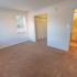 Bedroom with beige carpet and a window at Allandale Village apartments for rent in Newark, DE