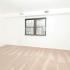 Bedroom with white walls and large window in Lansdowne, PA apartment for rent