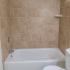 Brown beige tiled shower with white tub in Lansdowne, PA apartment for rent