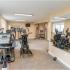 Fitness center with cardio machines and mirror in Willow Grove, PA apartments for rent