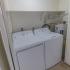 In-unit laundry room with full sized washer and dryer at Whiteland West Apartments in Exton, PA.