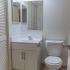Tiled bathroom with vanity sink and toilet at Whiteland West Apartments in Exton, PA.