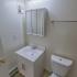 Bathroom with a cabinet and toilet at Black Hawk apartments for rent