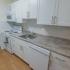 Contemporary kitchen with backsplash and white cabinets in West Chester, PA apartments for rent